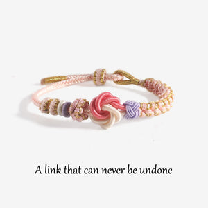 For Granddaughter - A LINK THAT CAN NEVER BE UNDONE Peach Blossom Knot Bracelet